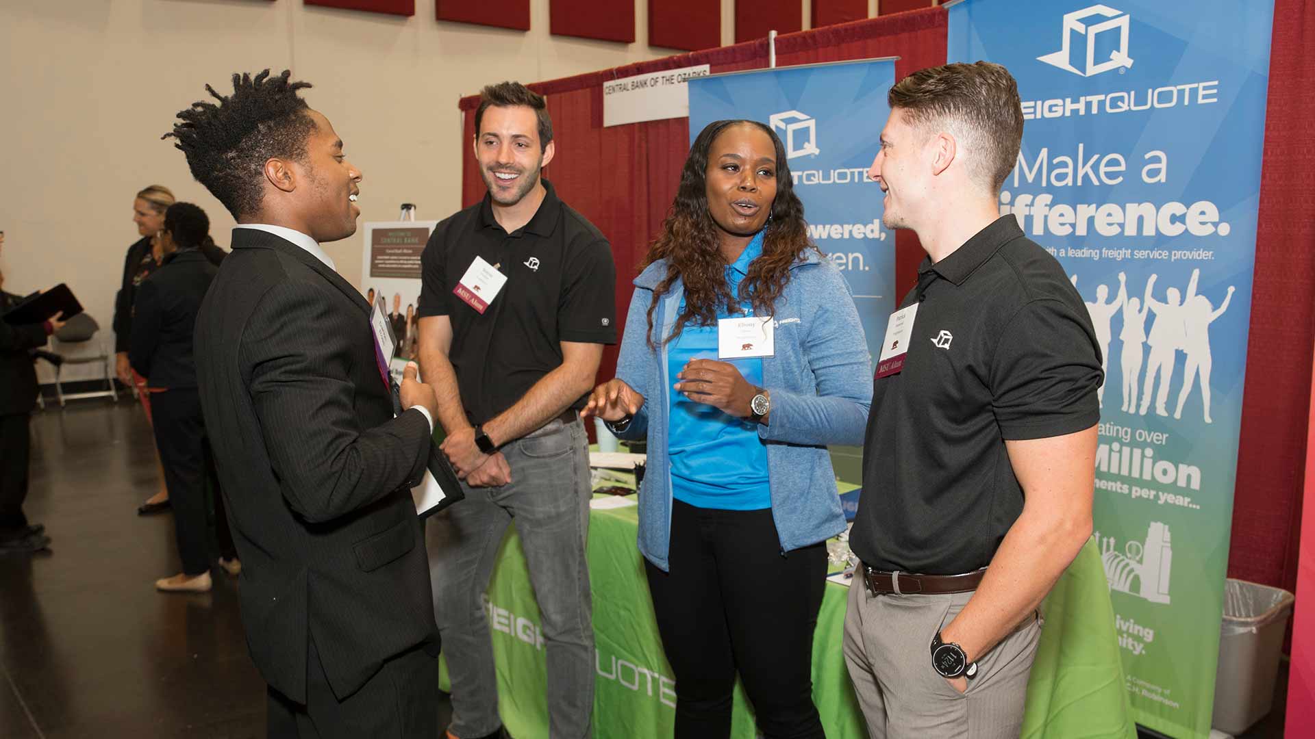 MSU alumni engage in a discussion during the College of Business Career Fair at the Springfield Expo Center.