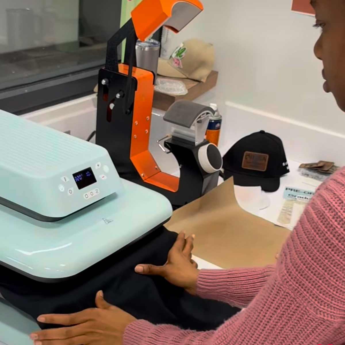 Student using a screenprinter.