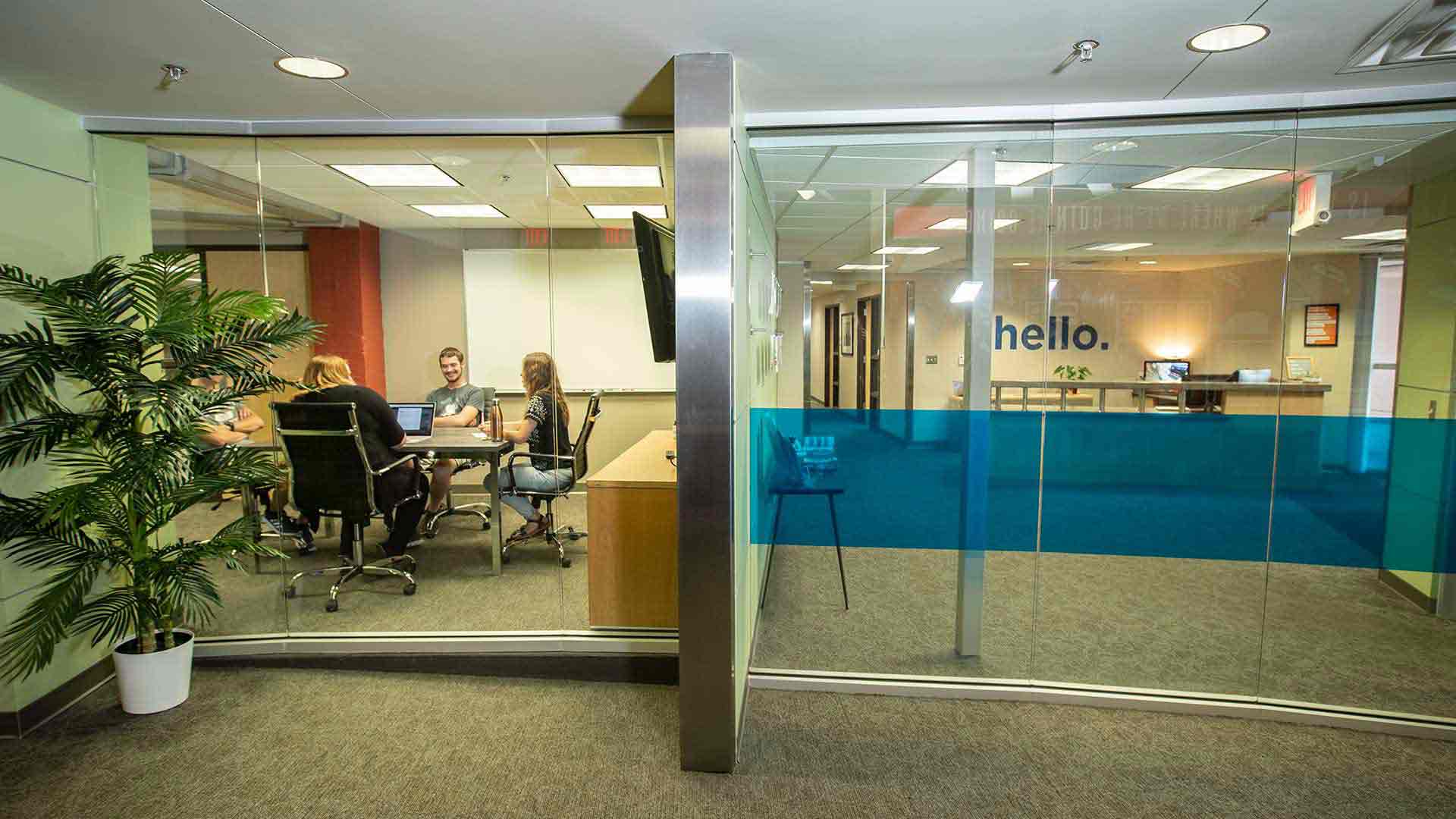 People in meeting room at efactory.