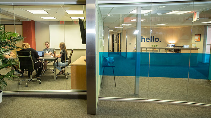 People in meeting room at efactory.