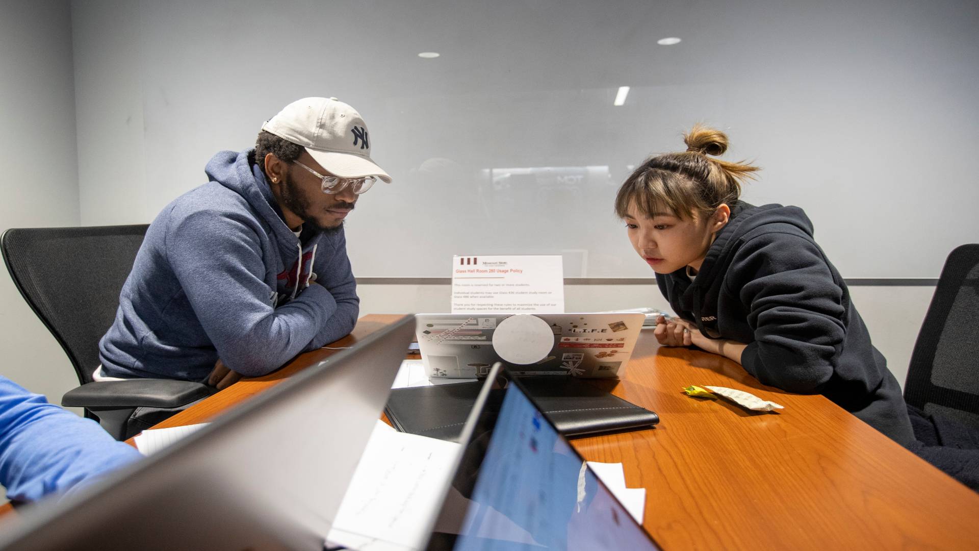 Students work on their Management and Human Resources projects.